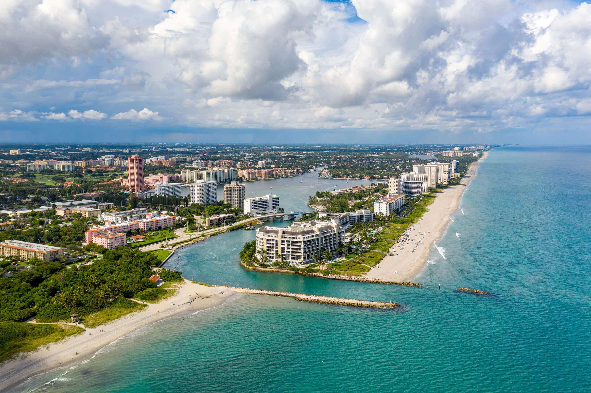 A body of water with a city in the background