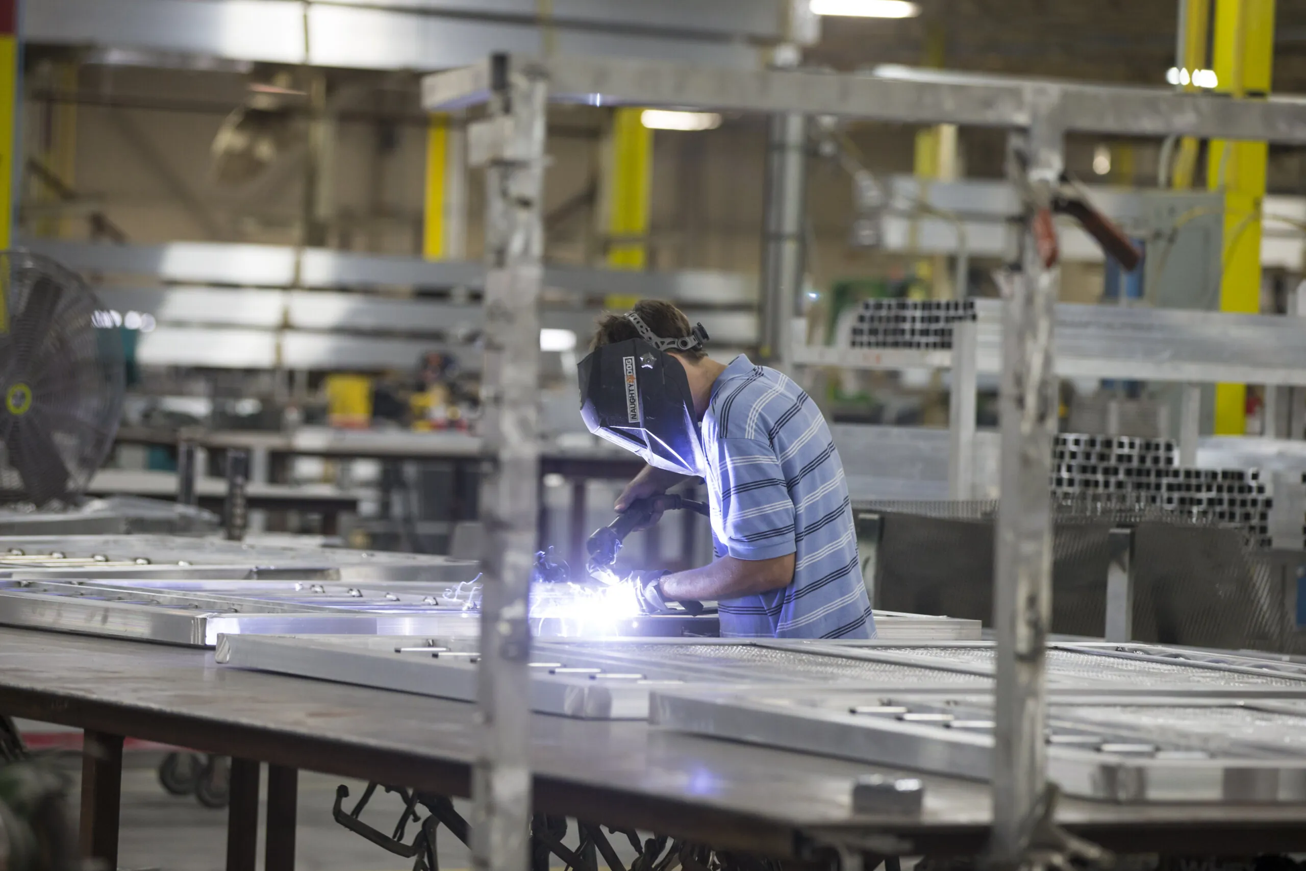 A welder in a manufacturing facility