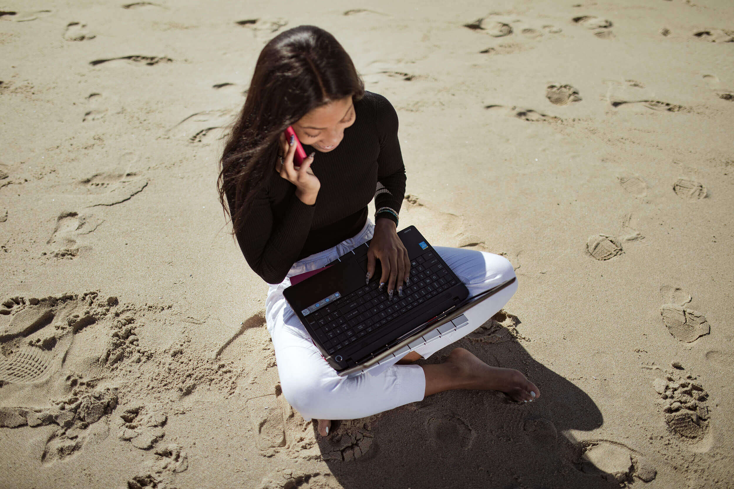 A woman sitting at a beach