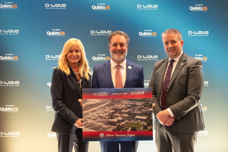 Group photo of three business people celebrating D-Wave opening HQ in Florida