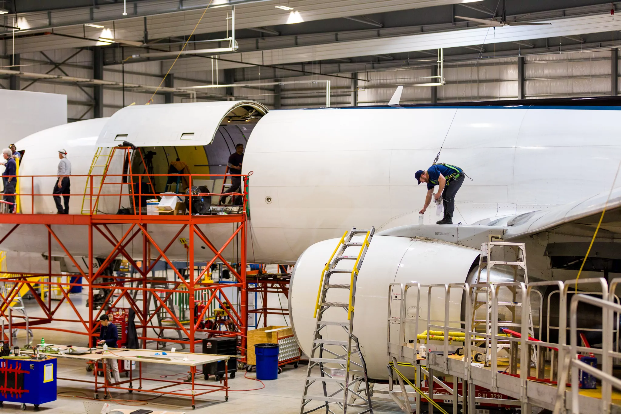 Aviation employees construct airplane’s outer shell at one of the top companies in Florida.