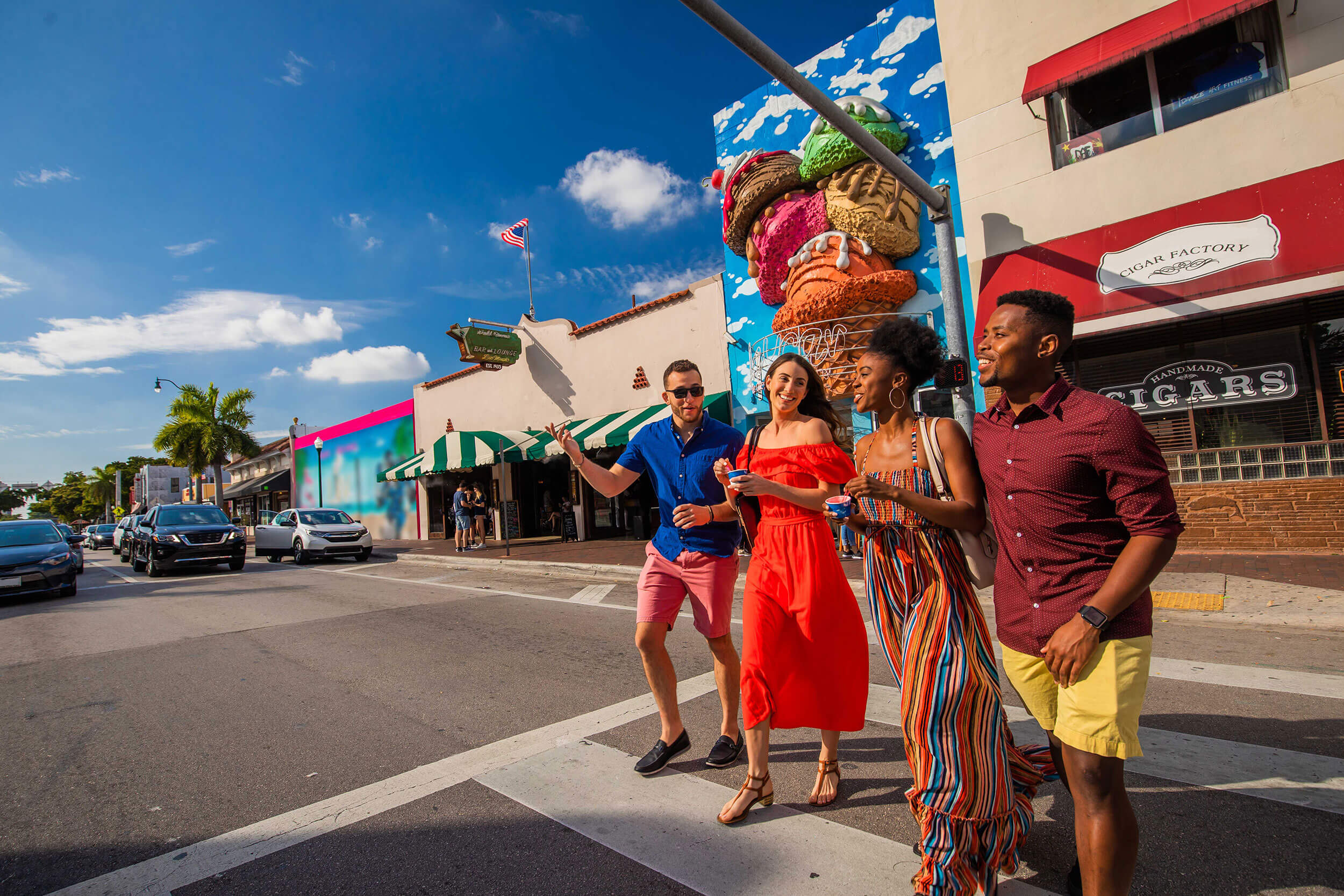 Four people cross the street in Little Havana, Miami.